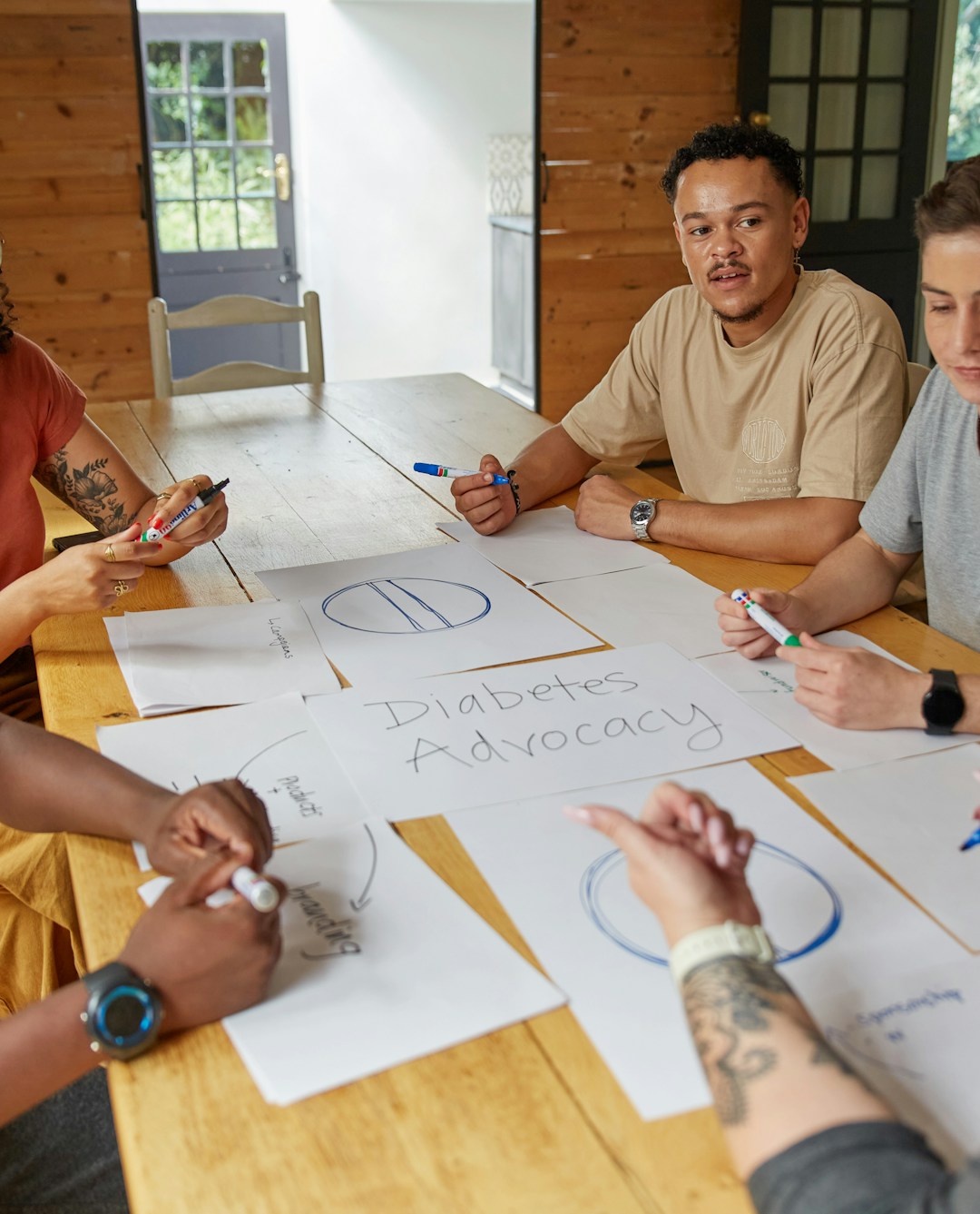 Healthcare professionals discussing regenerative treatments around a conference table.