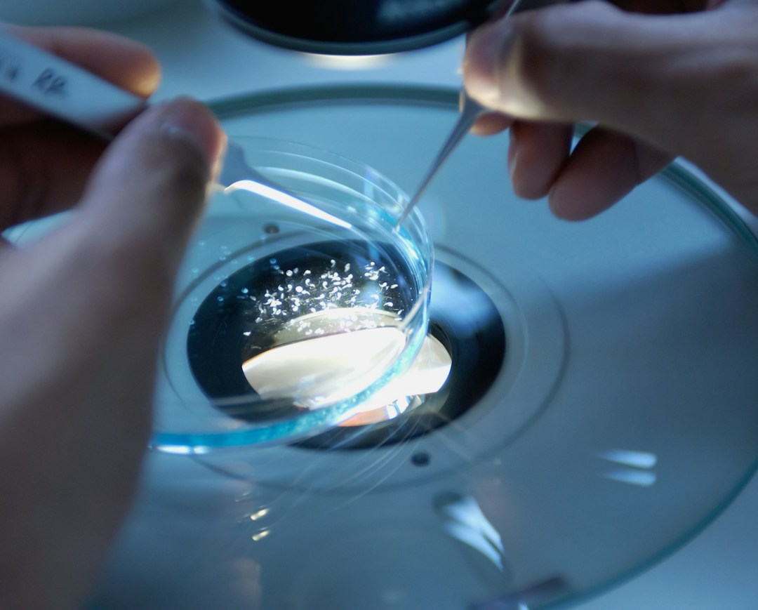 Close-up of a scientist handling stem cell samples in a high-tech laboratory.