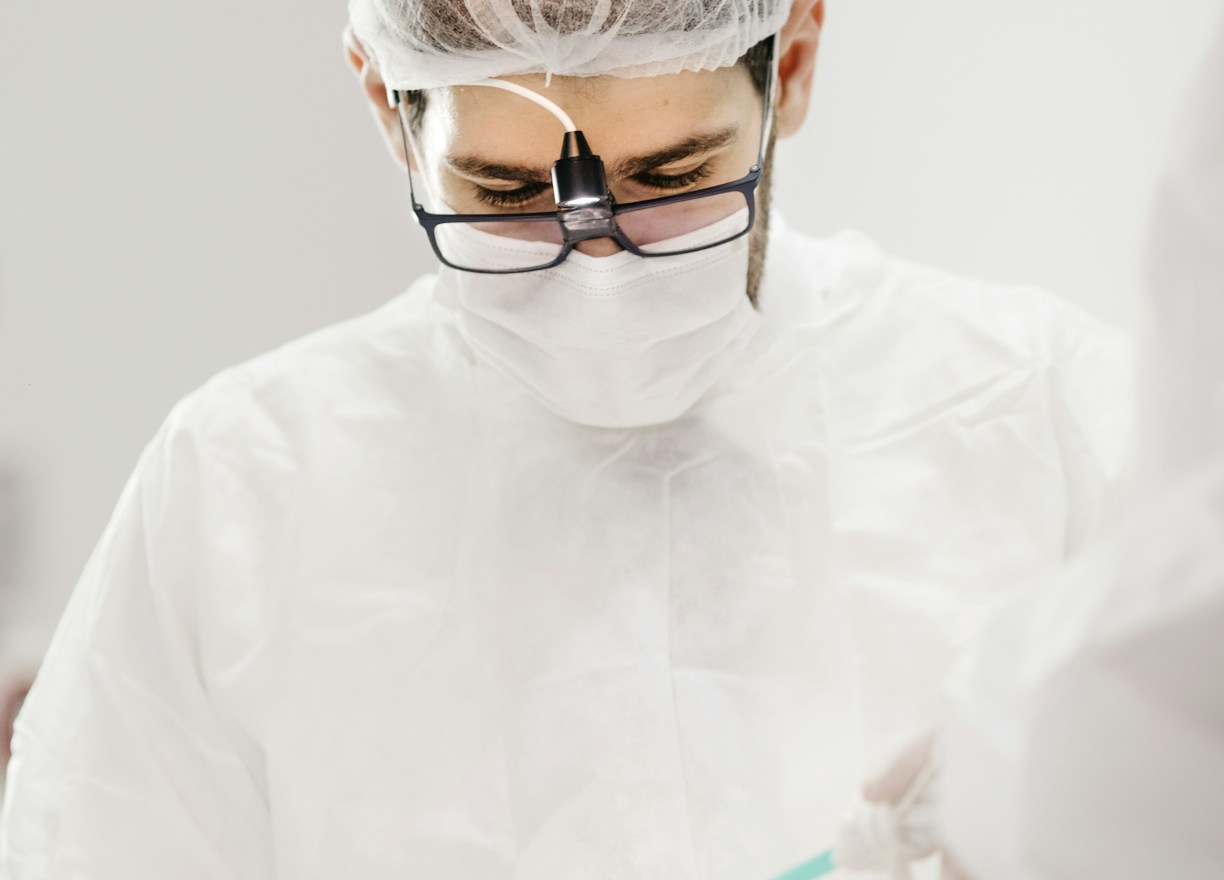 A medical professional demonstrating stem cell therapy techniques in a modern clinic.