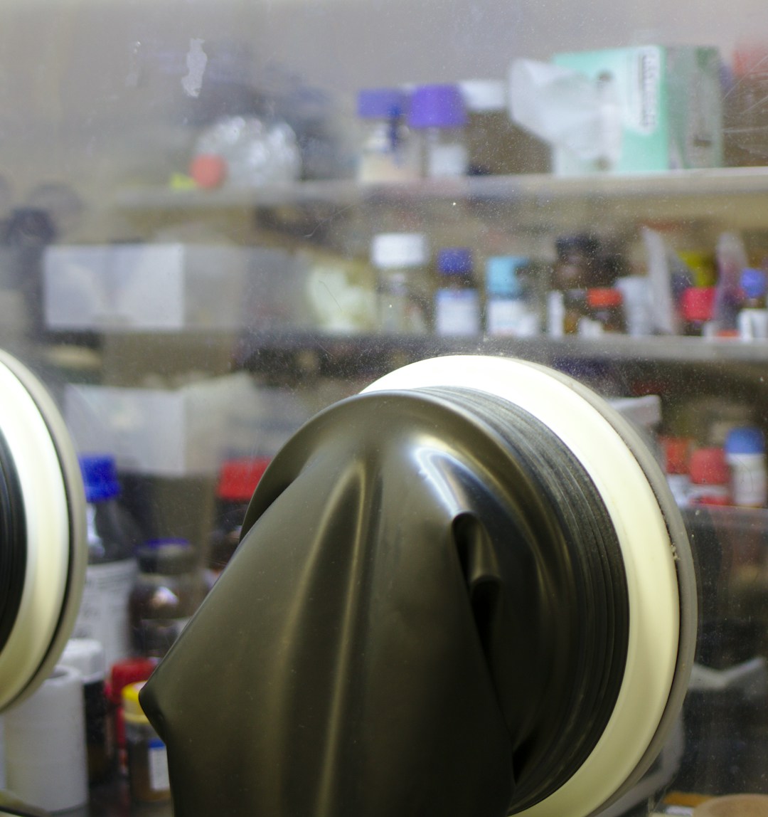 Laboratory environment featuring Cell101 stem cell treatment preparation with scientist in gloves working.