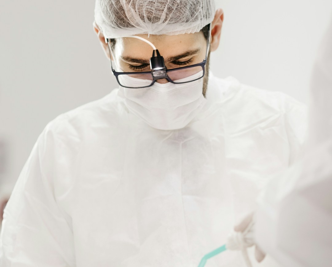 A medical professional demonstrating stem cell therapy techniques in a modern clinic.
