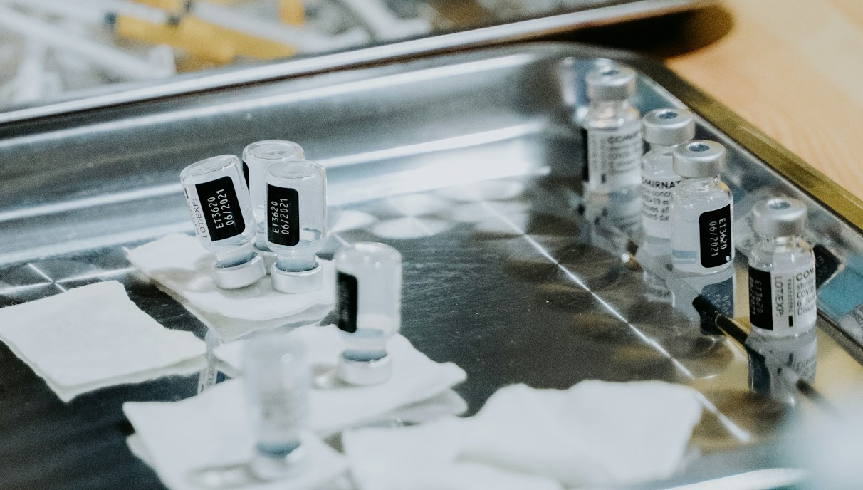 A close-up of medical professionals preparing stem cell therapy equipment in a clinical setting.