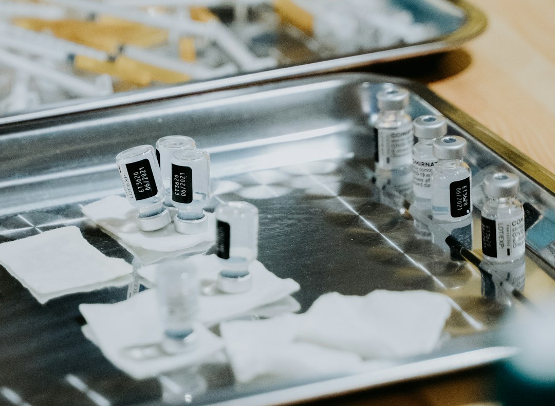 A close-up of medical professionals preparing stem cell therapy equipment in a clinical setting.