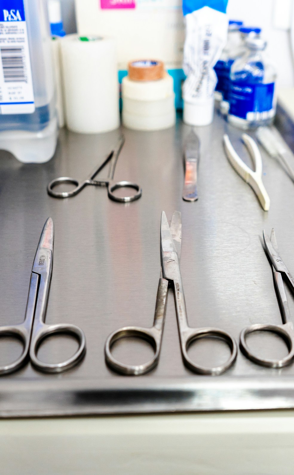 Detailed view of L&K spine instruments arranged neatly on a sterile tray.