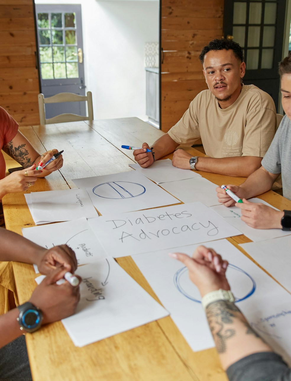 Healthcare professionals discussing regenerative treatments around a conference table.